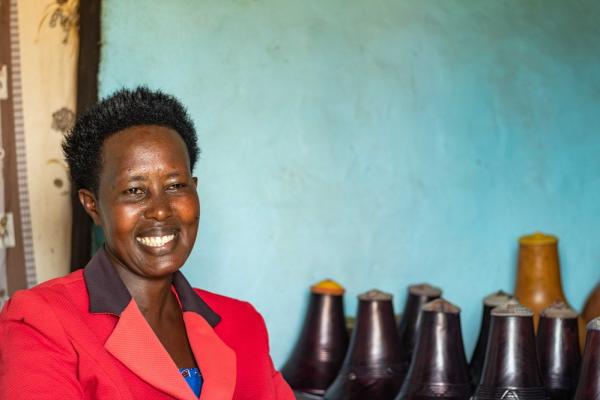 “With counselling from village health workers, I feel strengthened. I feel better with a hope that I will be healthy. I will not die.” Kedina Kedrace in her house smiling.
